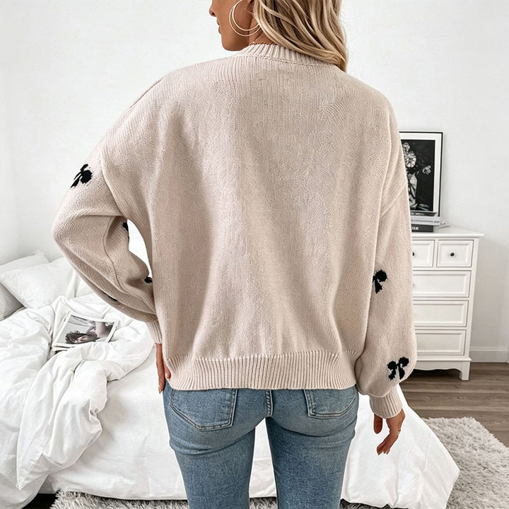 Bow-patterned knit sweater