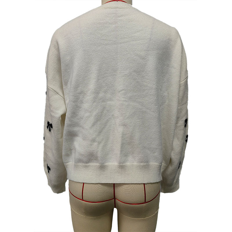 Bow-patterned knit sweater