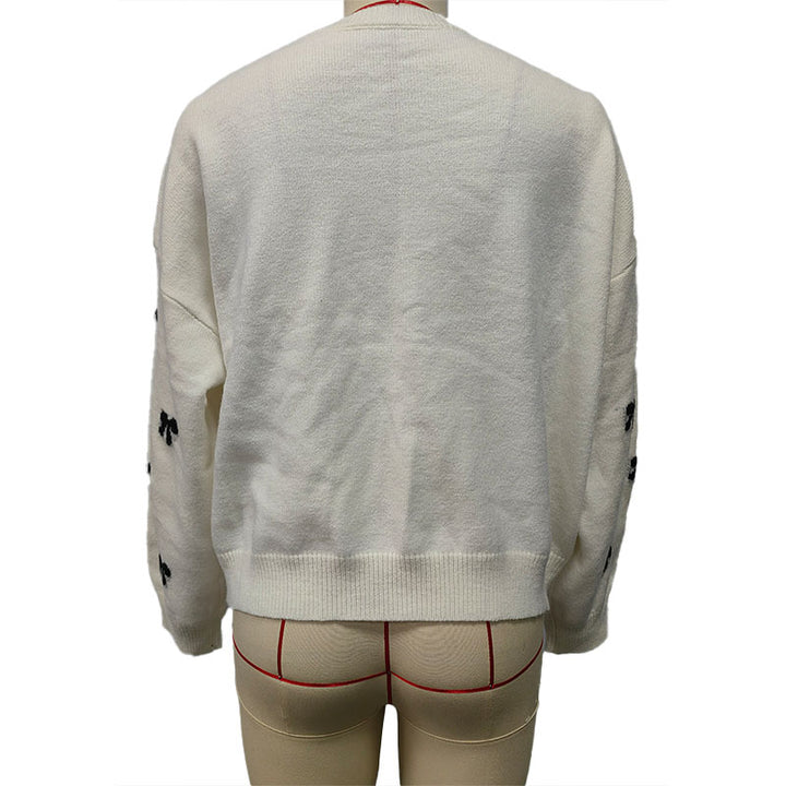 Bow-patterned knit sweater